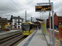 Tram 3018 arrives at King Street stop on a Didsbury bound service on the first day of town centre service 27/01/2014. Photo R Clarke